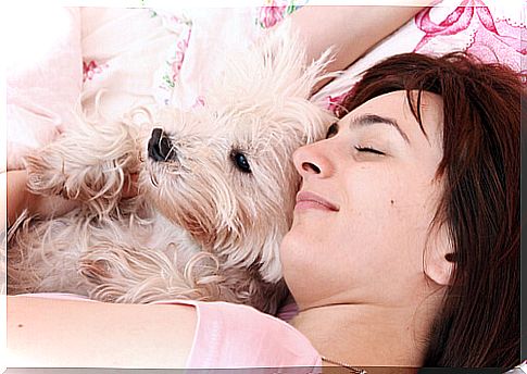 girl sleeps with her dog